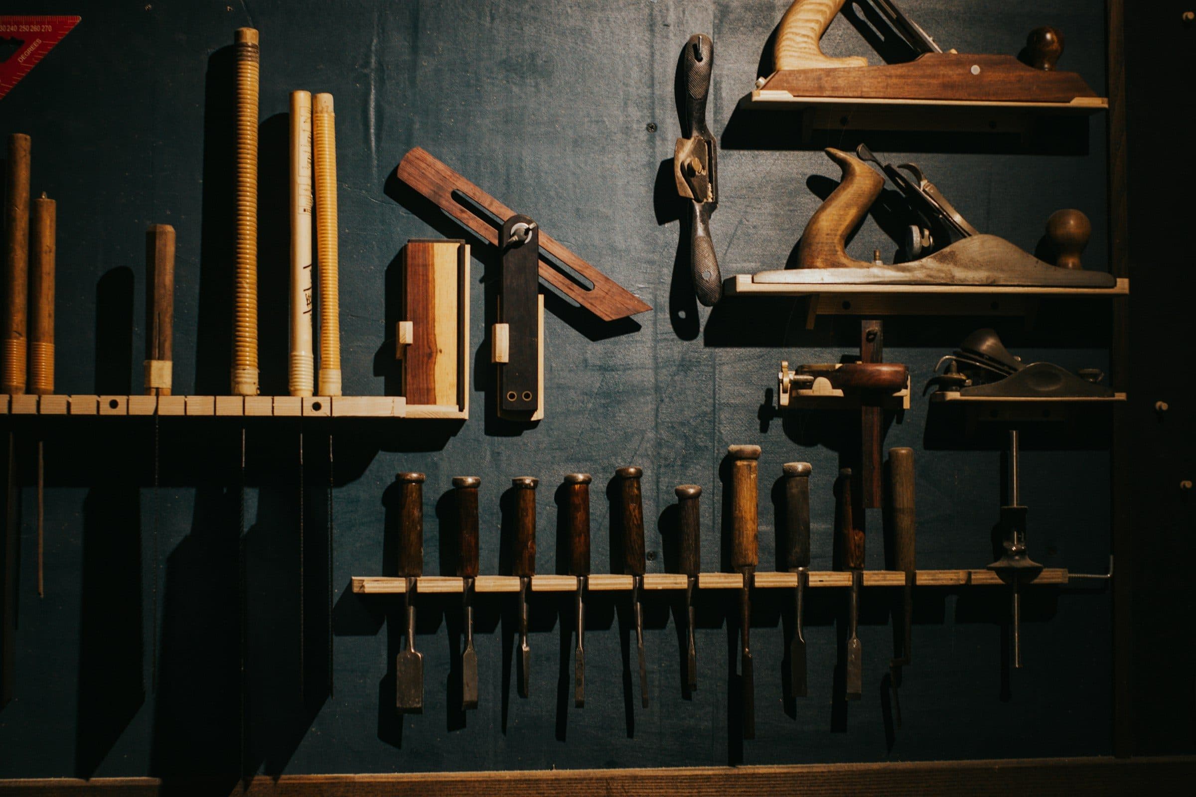 Organized wall of finishing tools in a workshop