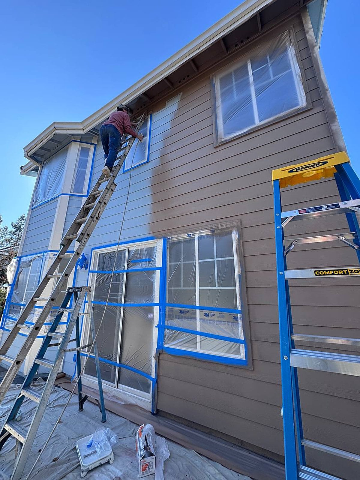 Exterior surfaces masked and prepped before painting