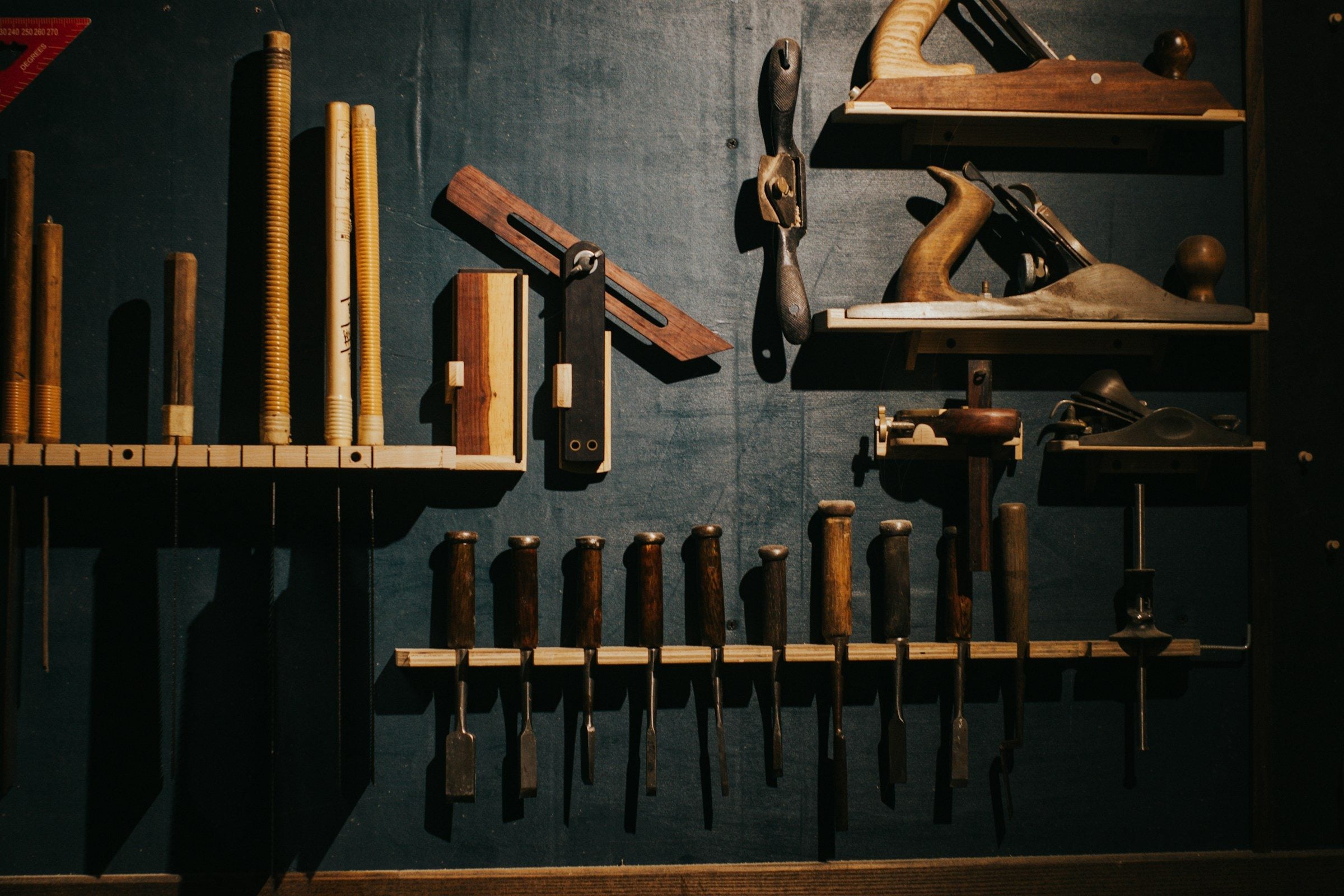 Organized wall of finishing tools in a workshop